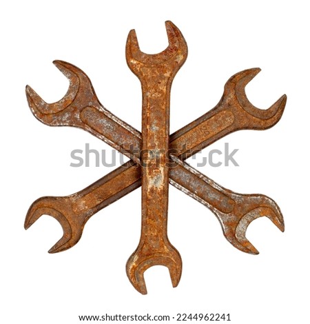 Rusty wrenches on a white background. Composition of wrenches in the form of a snowflake.