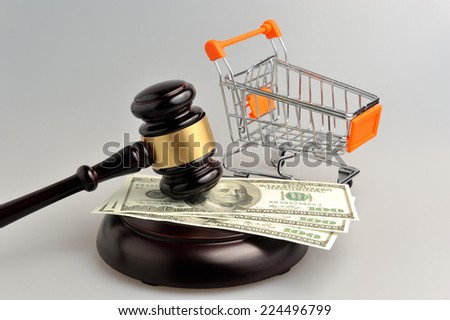 Hammer of auctioneer with pushcart and money on gray background Royalty-Free Stock Photo #224496799