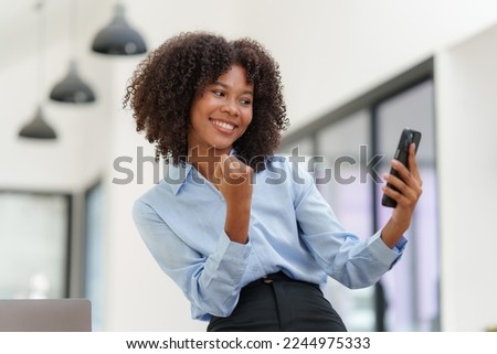 Business black woman having phone conversation with client in office. Woman reading news, report or email. Online problem, finance mistake, troubleshooting