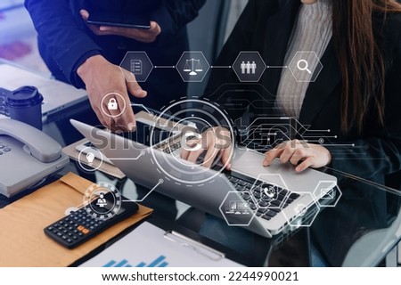 Copyright or patent concept, Business team analyzing data and using smart phone and tablet with virtual screen copyright icon trademark license, Creation ownership against piracy. at office
