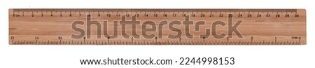 Wooden ruler with metric and inch scale - isolated on white for easy selection Royalty-Free Stock Photo #2244998153