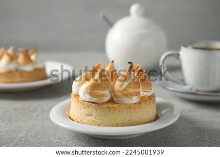 Delicious lemon meringue pie on grey table