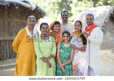 Portrait of an Indian family standing together at village Royalty-Free Stock Photo #2245015749
