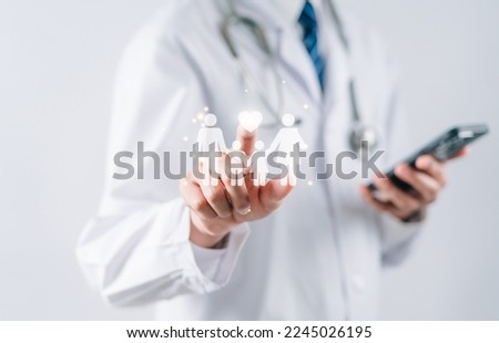 Insurance concept. Doctor in uniform hands holding family virtual icon, family home, foster care, homeless support, protect, health care, world mental health day, Autism support, home school education Royalty-Free Stock Photo #2245026195