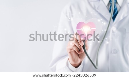 Doctor in white coat holding heartbeat icon for positive healthcare insurance symbol concept, Mental health care, medical check up, heart attack, cardiology, help from specialist concept. Royalty-Free Stock Photo #2245026539