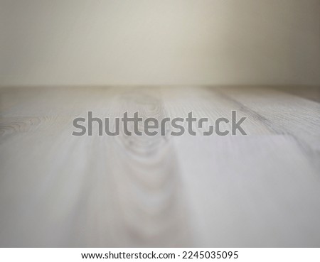 Soft natural wood planks in perspective with out of focus effect for product photography. Still life photography background with depth of field.