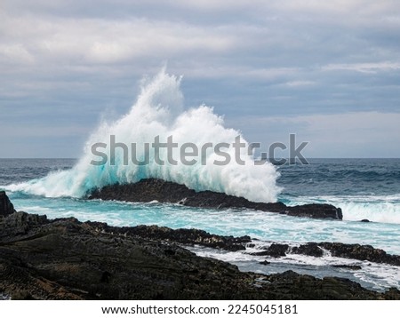 Indian Ocean waves crashing onto rocks. Storms River, Garden Route, Easten Cape, South Africa. Royalty-Free Stock Photo #2245045181