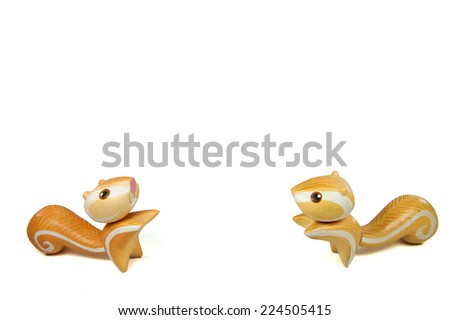 Handmade wood orange twin squirrel; This can use for decorate place and make background until powerpoint presentation.