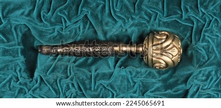 golden scepter on green velvet Royalty-Free Stock Photo #2245065691