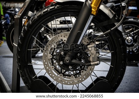 Closeup of new shock absorber and disc brake of motorcycle.