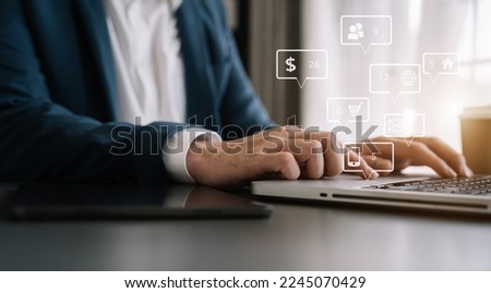 Social media and Marketing virtual icons screen of businessmen typing keyboard with laptop computer at office.