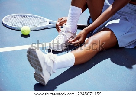 Tennis player woman, shoelace and ready for game, training or exercise sneakers in development, sports or focus. Sport expert, girl athlete and professional shoes with tennis ball, racket and goals Royalty-Free Stock Photo #2245071155
