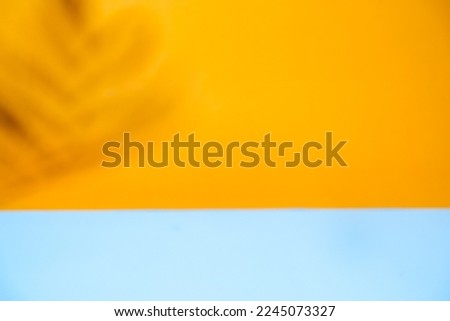 Background texture of orange wall and blue color underline, background for foto product 
