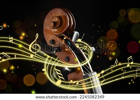 Staff with music notes and symbols braiding violin head on black background, closeup. Bokeh effect