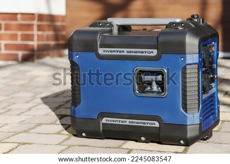 Portable Inverter Generator To Connect Electricity To House. Petrol Generator AC - motor portable. Royalty-Free Stock Photo #2245083547