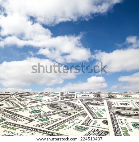 The road out of the dollar in the blue sky with clouds