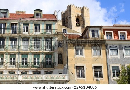 Traditional neighborhood in the old town of Lisbon, Portugal, Europe. Downtown streets with historical houses. Colorful cityscape and urban landscape of the Portuguese capital. Royalty-Free Stock Photo #2245104805