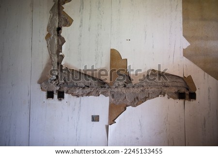 Old Abandoned Haunted Kempton Hospital in South Africa that has fallen into disrepair and looted since it closed. Broken windows and ceilings with glass everywhere. perfect for haunted house and ghost Royalty-Free Stock Photo #2245133455