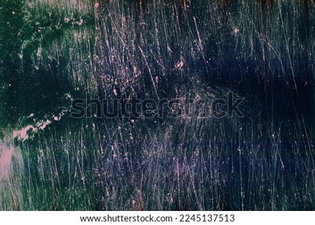 Abstract scratched film texture background with grain, dust and light leak