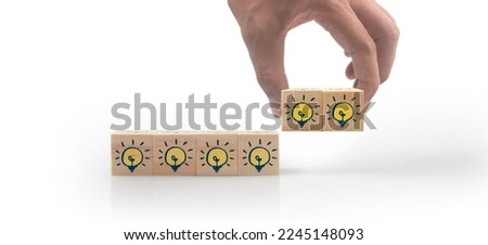 Wooden cubes in a hand with copy space for input wording