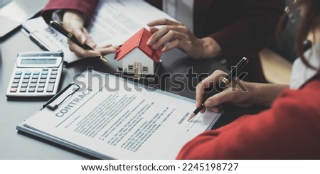 Real estate agent offer hand for customer sign agreement contract signature for buy or sell house. Real estate concept contact agreement concept