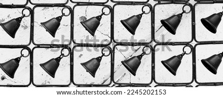 Cast Iron Fence. Decorated with black bells. Rustic Wapplaler. Background