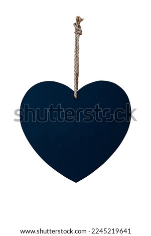 Blank chalkboard in the shape of a  heart hanging on a string, love and Valentine's day ornament isolated on white background