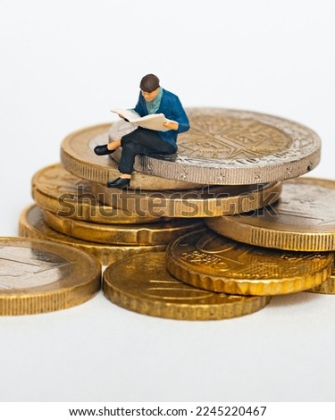 European coins  saving money  man setting up the saving money. 