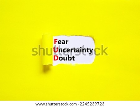 FUD fear uncertainty doubt symbol. Concept words FUD fear uncertainty doubt on white paper on a beautiful yellow background. Business and FUD fear uncertainty doubt concept. Copy space.