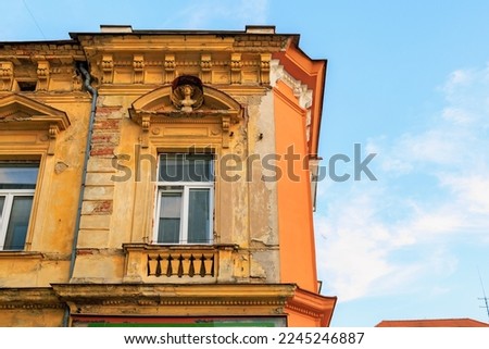 Corner of the house of classical European architecture of the old cozy tourist city. Background with selective focus and copy space