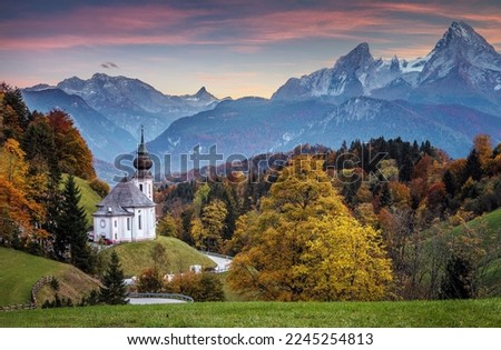 Incredible nature landscape at sunset. Incredible autumn scenery. Scenic mountain landscape in the Bavarian Alps. Small church on the highland. View on famous Maria Gern Church of Alps Royalty-Free Stock Photo #2245254813