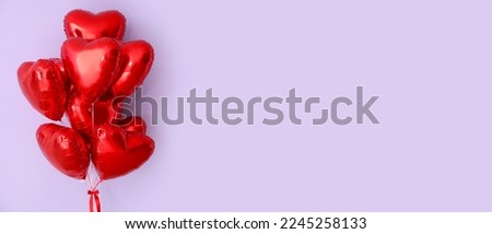 Many heart-shaped balloon for Valentine's Day on lilac background with space for text Royalty-Free Stock Photo #2245258133