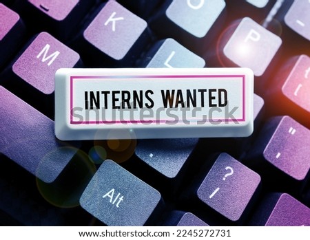 Sign displaying Interns Wanted. Business overview Looking for on the job trainee Part time Working student