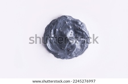 The gray charcoal texture spot on a white background