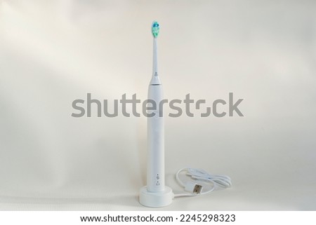 Electric sonic toothbrush isolated on white background