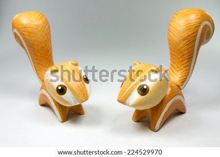 Handmade wood orange twin squirrel; This can use for decorate place and make background until powerpoint presentation.