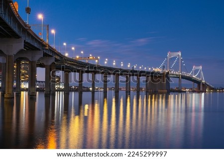 A nightscape photo of New York City Throgs Neck Bridge from Queens to the Bronx 