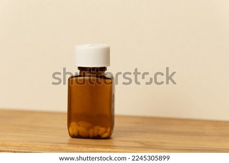 Product photography: medicine bottle and tablets on the table