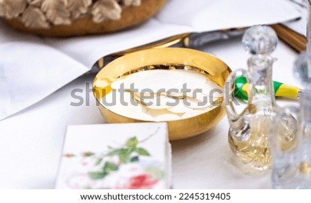Golden eucharistic vessel with communicants. Holy Communion in the Catholic Church.