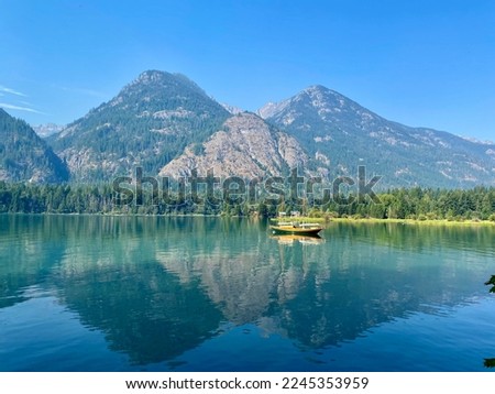 Reflection on Lake Chelan in North Cascades National Park. Royalty-Free Stock Photo #2245353959