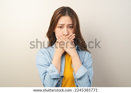 beauty woman checking oral smell isolated on background Royalty-Free Stock Photo #2245385771