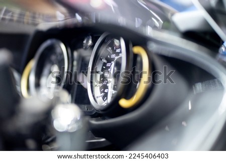 Close-up of tachometer of modern car, use light effect.