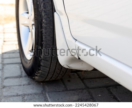 Car front tyre mud guard Royalty-Free Stock Photo #2245428067