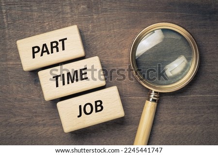 Part Time Job text on wood blocks, with magnifying glass on wood background, seeking, and looking for part time job concept Royalty-Free Stock Photo #2245441747