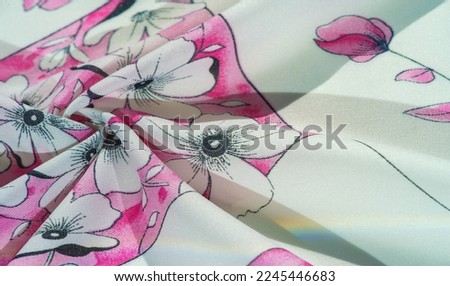 silk fabric, print of flowers of a field cornflower, cream-white color with pink shades, blue border "cornflower blue". Background texture, pattern, collection