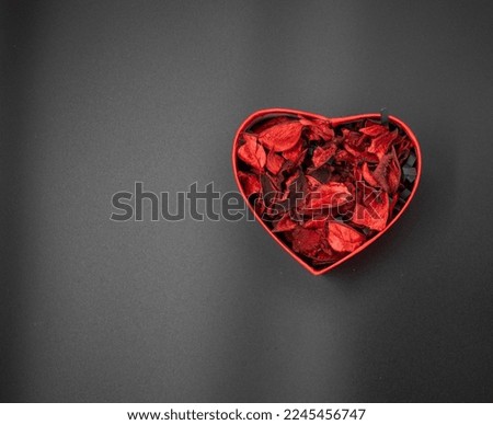 Red heart shaped gift box on black background,Valentine's Day or birthday concept, copy space area