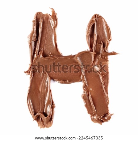 Cream chocolate spreading in shape letter H, alphabet isolated on white, , top view