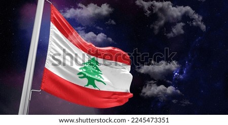 Lebanon national flag cloth fabric waving on beautiful Blue Bakckground.
