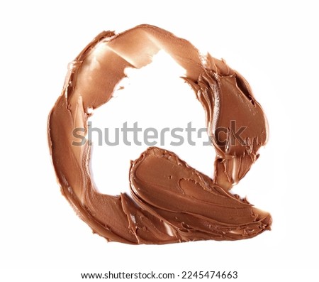 Cream chocolate spreading in shape letter Q, alphabet isolated on white,  top view