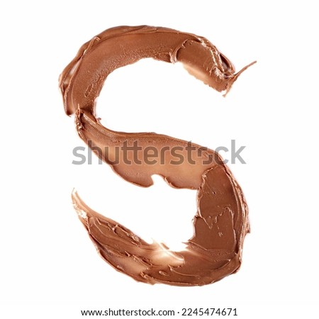 Cream chocolate spreading in shape letter S, alphabet isolated on white,  top view